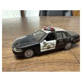 Toy 1:44 scale toy police car