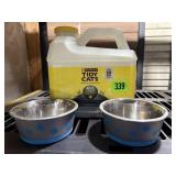 Partial jug of kitty litter, food & water dishes
