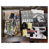 Box of automotive parts, decals, gaskets, gauges