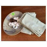 Pottery dish, cloth napkins, napkin rings