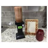 Picture frame, pillar candle, red glassware