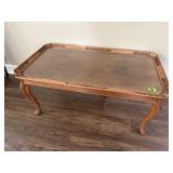 Wood carved glass top coffee table