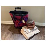 Rolling carry on bag, bath towels, hand towels