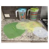 Plastic beverage pitchers (2), silicone lids