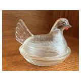 Clear glass hen on nest