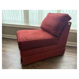 Red armless easy chair