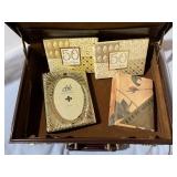 Briefcase of photo albums, picture frame