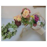 four small fake floral arrangements
