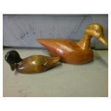 two hand carved ducks
