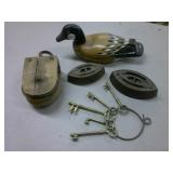 wood duck, brass keys, sad irons, wood pulley