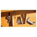 large caliber shells, one is empty, knife