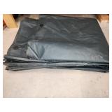 heavy plastic tarp, size unknown