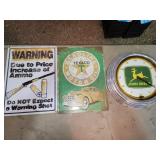 tin signs and John Deere clock