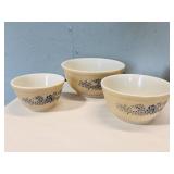 three Pyrex mixing bowls