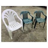 three resin deck chairs