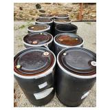 ten plastic barrels, nine lids