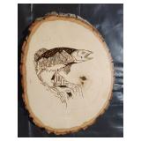 woodburned fish on wood