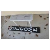 Welcome board and bench