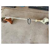 Stihl trimmer with sawblade mounted