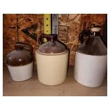 three brown jugs