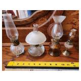 four small oil lamps