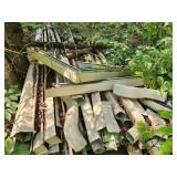 pile of aluminum rain gutters (used)