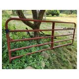red farm gate with hinges