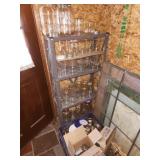 canning jars on shelf and floor in utility room