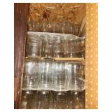 canning jars, bottles in cupboard