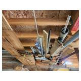 pile of scrap lumber and items in rafter in photo