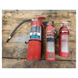 one charged, two empty fire extinguishers