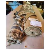 sage and plaid fabric rolls