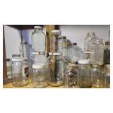 Shelf of various quart and larger glass jars Shelf of various quart and larger glass jars