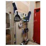 Assorted brooms, mops, Etc