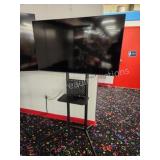 Samsung 50 in flat screen TV with rolling TV stand