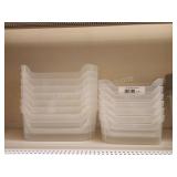 14  assorted clear storage organizer trays