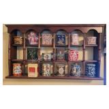 Decorative wooden shelf with collector tins