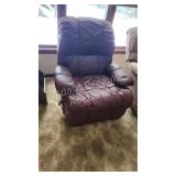 Maroon leather rocker recliner, ideal for garage