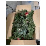 Large box of assorted small Christmas trees and