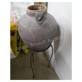 Decorative metal planter with wrought iron base