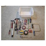 Assorted hand tools - hammers, pliers, measuring