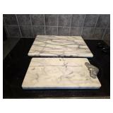 2 solid marble cutting boards,  12 in x 16 in a