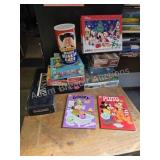 Assortment jigsaw puzzles, board games, coloring