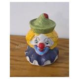 Vintage ceramic clown piggy bank, likely dating