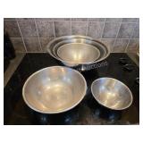 Five stainless steel mixing bowls