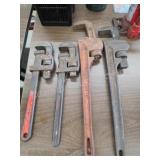 Four assorted vintage rigid and Walworth pipe