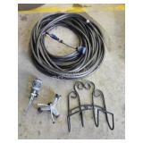 Decorative metal hose hanger with garden hose,