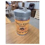 Three Crow brand steel cut coffee storage tin