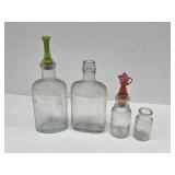 Four vintage antique glass bottles