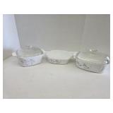 Six pieces CorningWare covered casserole dishes,